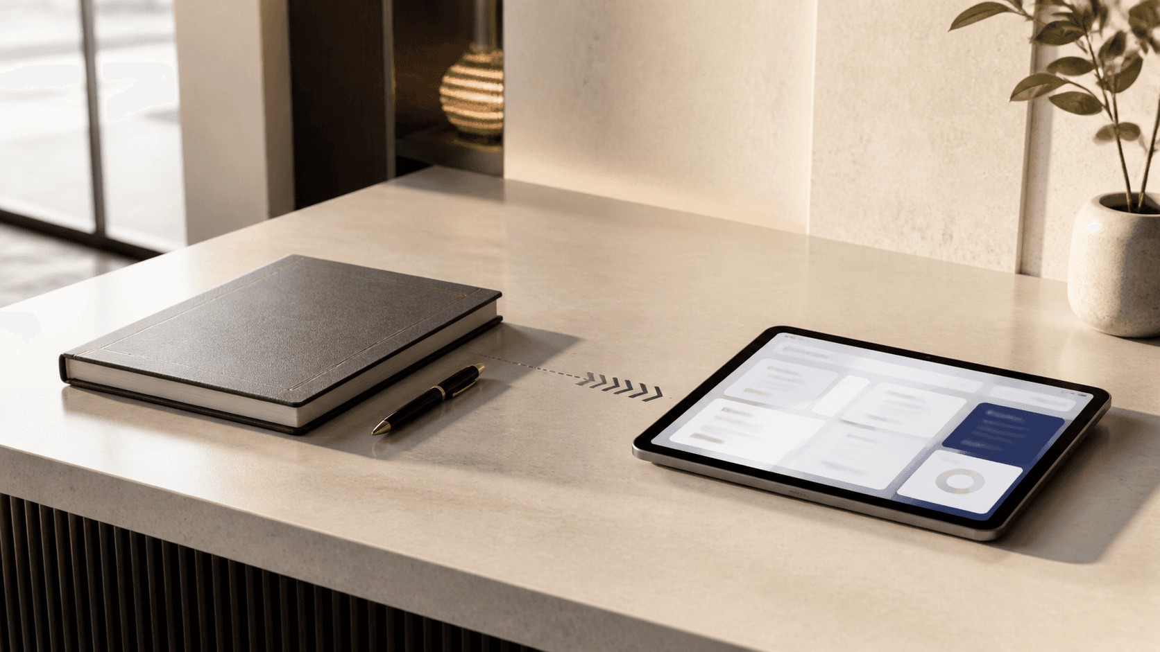 Paper visitor logbook beside a tablet in a modern reception area
