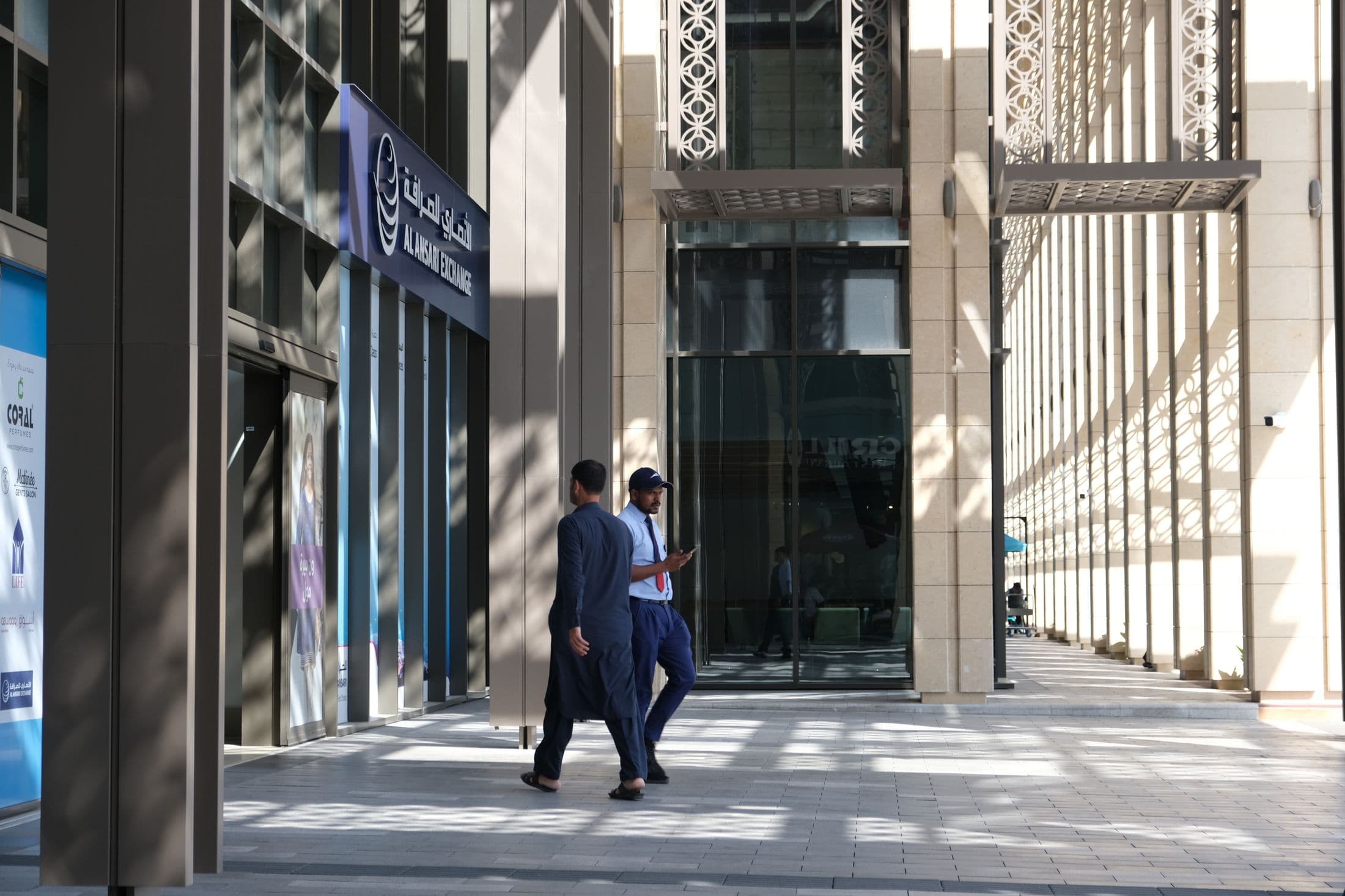 People moving through a modern business building in Dubai